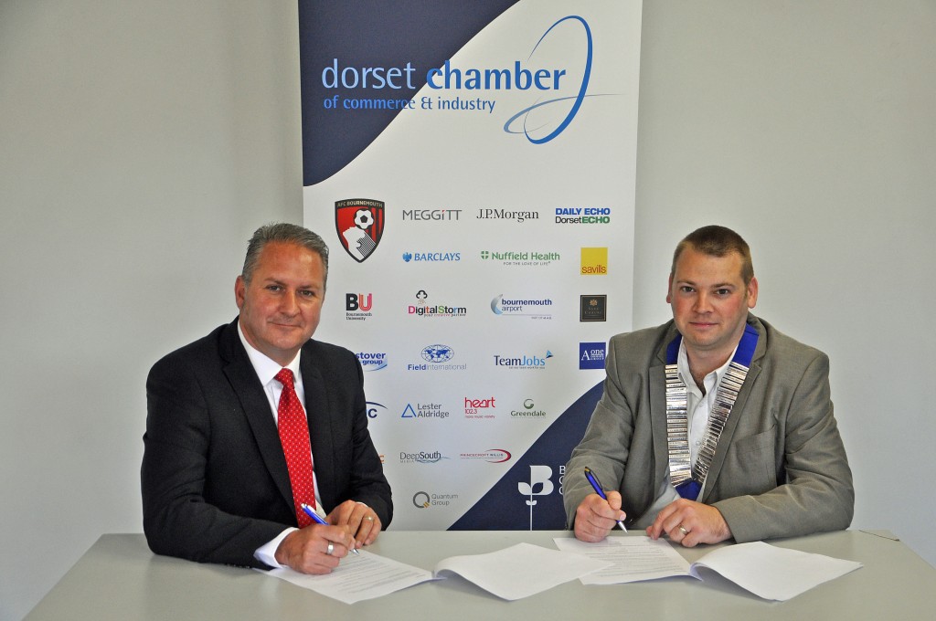 Ian Girling, DCCI's chief executive and Bridport president Richard Smith, sign up.